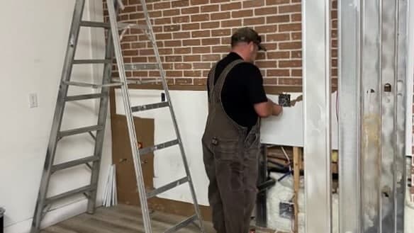Beretta Electric electrician installing light switch in Kelowna, British Columbia.